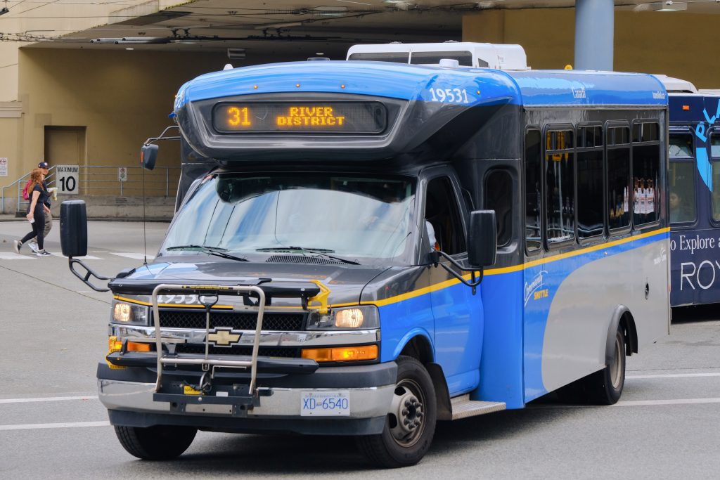A translink 28 foot cutaway minibus turning out to start its route on the 31 to river district.